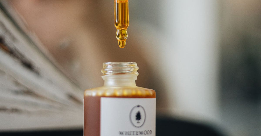 Vitamin C serum dropper bottle, minimalist skincare aesthetic