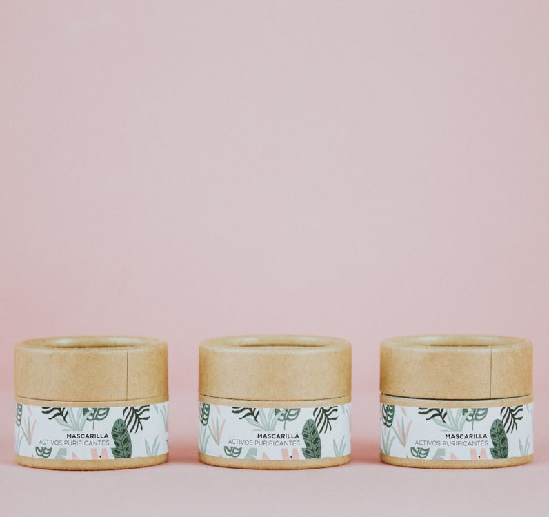 Close-up of eco-friendly skincare jars with botanical ingredients
